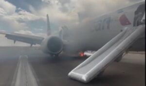 Emergency Evacuation! American Airlines Flight Aborts Takeoff After Landing Gear Fire